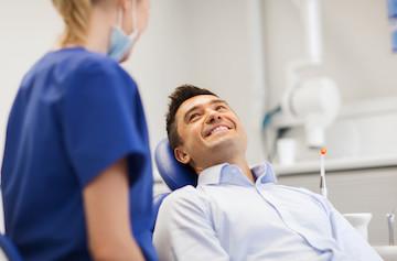 man getting tooth-colored fillings at the dentist